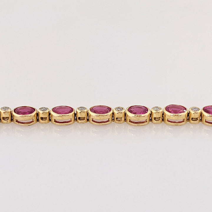 14K RUBY OVAL 3X4 (9) WITH .12 DIAMOND TOTAL WEIGHT ESTATE BRACELET 8.0 GRAMS