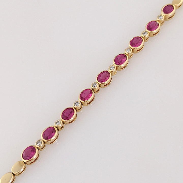 14K RUBY OVAL 3X4 (9) WITH .12 DIAMOND TOTAL WEIGHT ESTATE BRACELET 8.0 GRAMS
