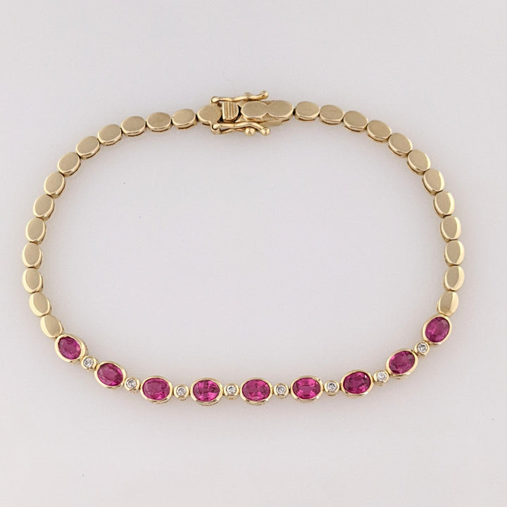 14K RUBY OVAL 3X4 (9) WITH .12 DIAMOND TOTAL WEIGHT ESTATE BRACELET 8.0 GRAMS