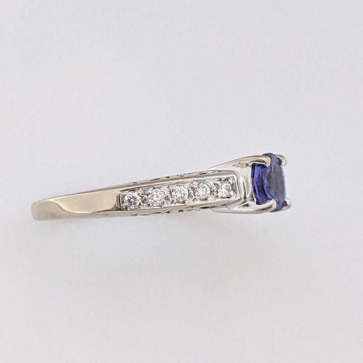 18K WHITE TANZANITE ROUND .65 CARAT TOTAL WITH .14 DIAMOND TOTAL WEIGHT (10) ROUND ESTATE RING 3.8 GRAMS