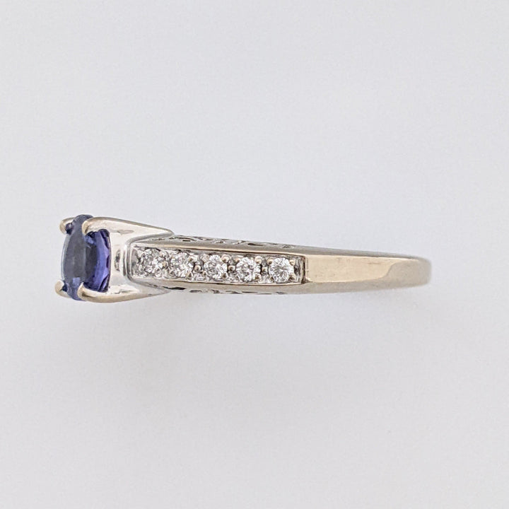 18K WHITE TANZANITE ROUND .65 CARAT TOTAL WITH .14 DIAMOND TOTAL WEIGHT (10) ROUND ESTATE RING 3.8 GRAMS
