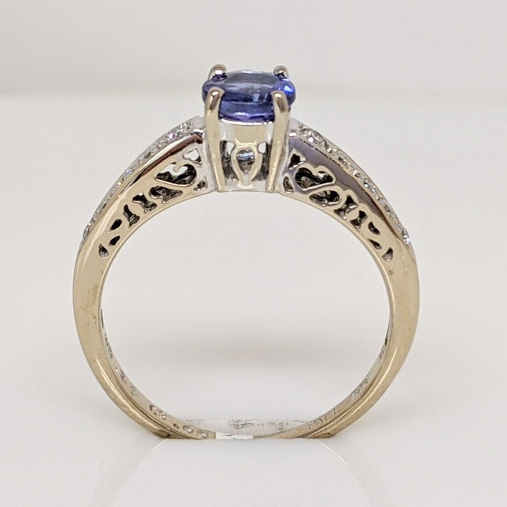 18K WHITE TANZANITE ROUND .65 CARAT TOTAL WITH .14 DIAMOND TOTAL WEIGHT (10) ROUND ESTATE RING 3.8 GRAMS