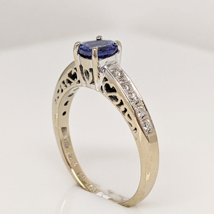 18K WHITE TANZANITE ROUND .65 CARAT TOTAL WITH .14 DIAMOND TOTAL WEIGHT (10) ROUND ESTATE RING 3.8 GRAMS