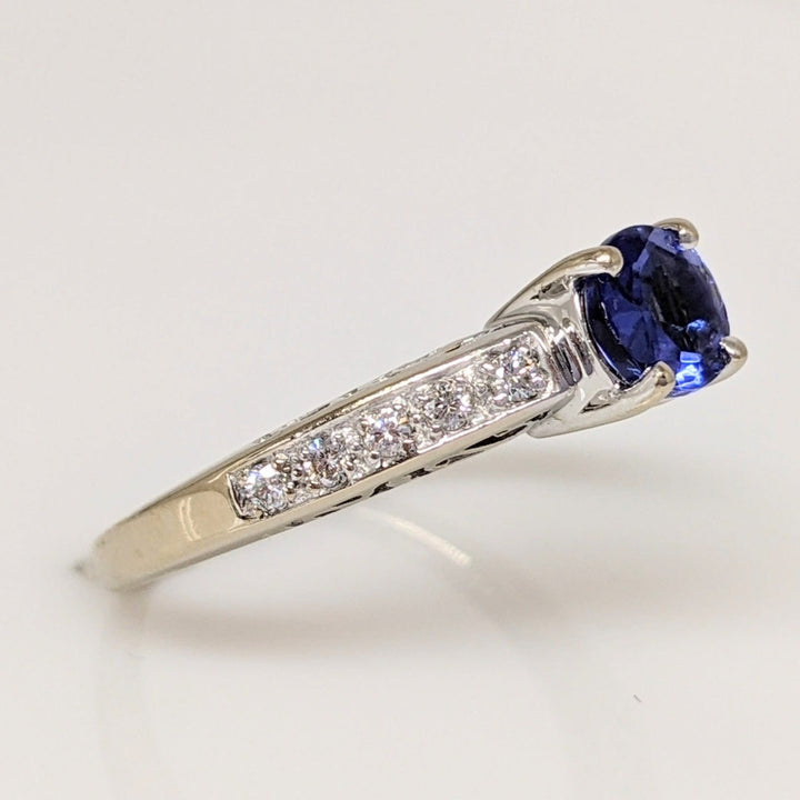 18K WHITE TANZANITE ROUND .65 CARAT TOTAL WITH .14 DIAMOND TOTAL WEIGHT (10) ROUND ESTATE RING 3.8 GRAMS
