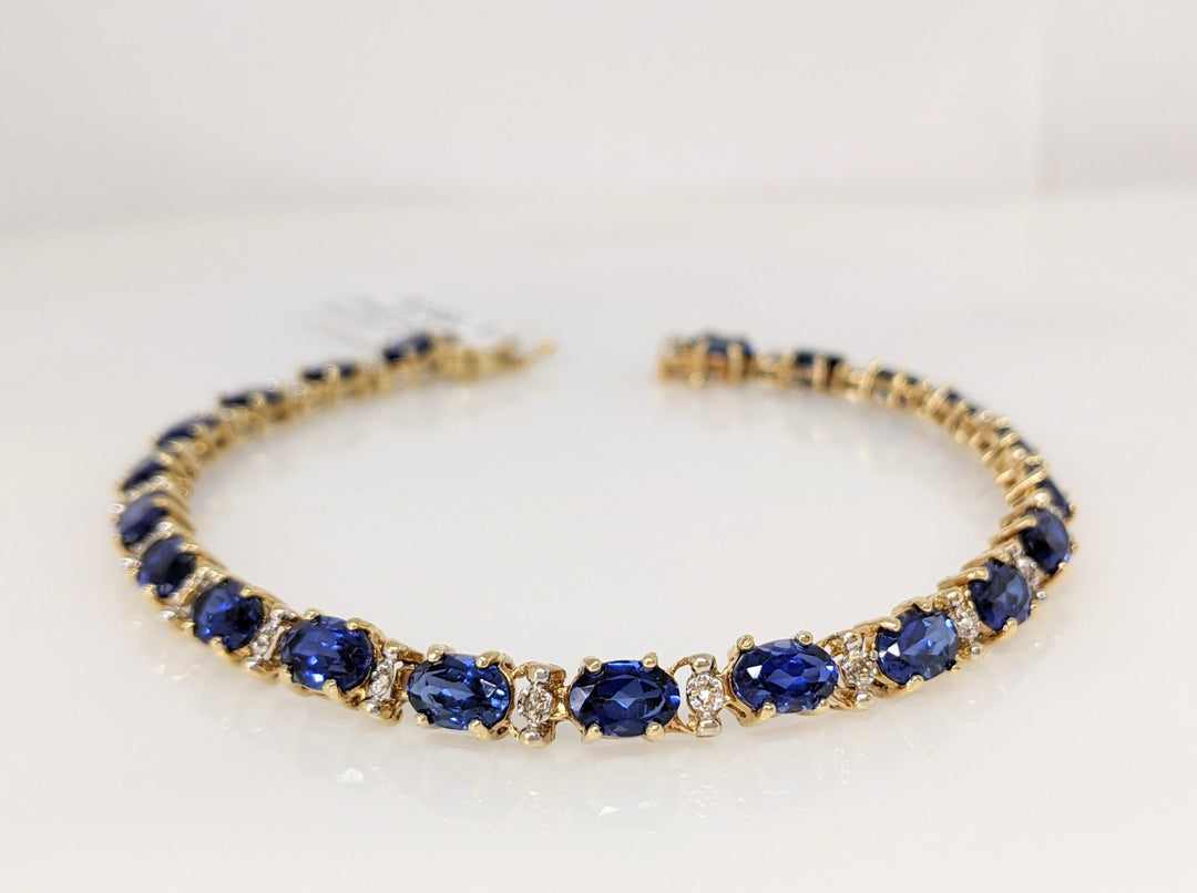 10K SYNTHETIC SAPPHIRE OVAL 4X6 (21) WITH MELEE ESTATE BRACELET 9.0 GRAMS