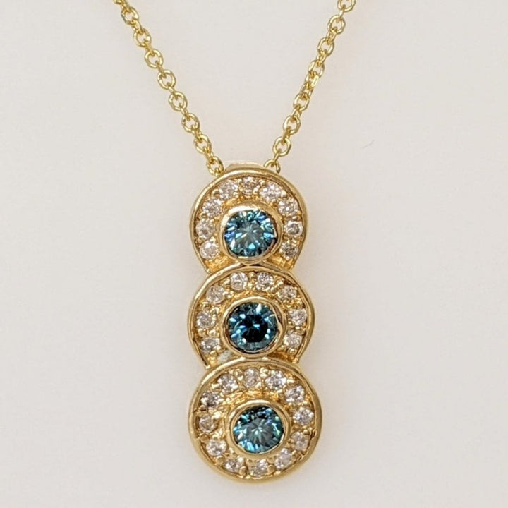 14K .65 CARAT TOTAL WEIGHT I1-I2 BLUE (3) WHITE (29) BEZEL ESTATE PENDANT & CHAIN 3.6 GRAMS