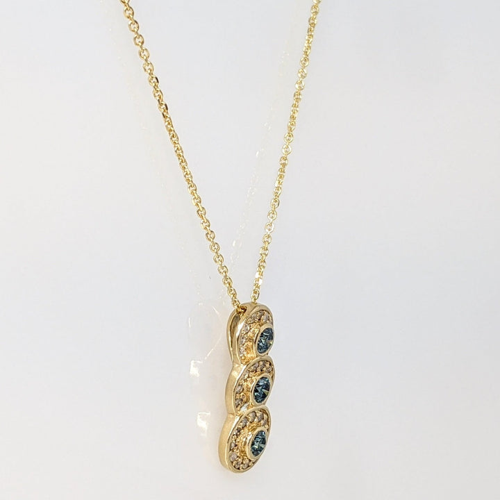14K .65 CARAT TOTAL WEIGHT I1-I2 BLUE (3) WHITE (29) BEZEL ESTATE PENDANT & CHAIN 3.6 GRAMS