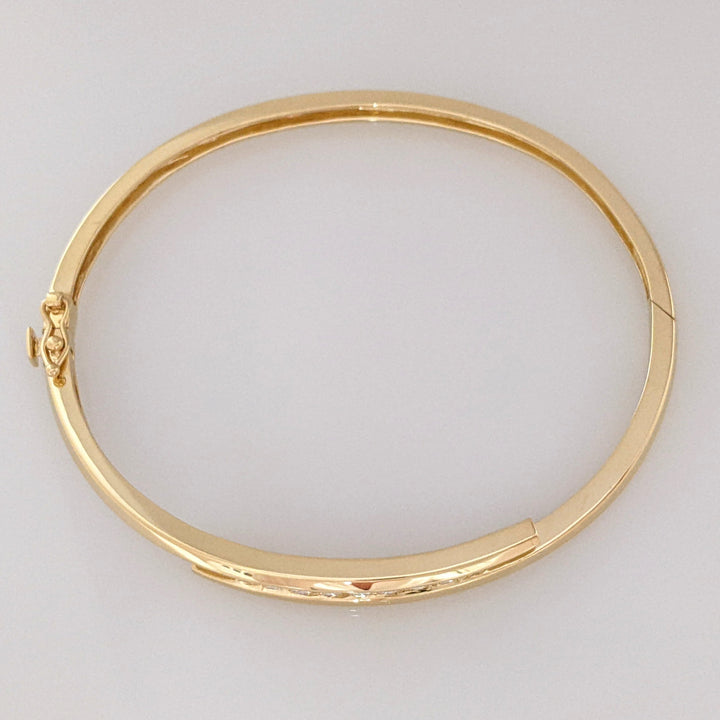 14K .54 CARAT TOTAL WEIGHT VS2 J DIAMOND ROUND (9) BYPASS CHANNEL SET ESTATE BANGLE 14.4 GRAMS