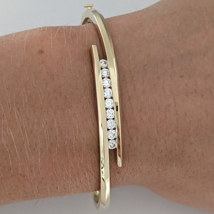 14K .54 CARAT TOTAL WEIGHT VS2 J DIAMOND ROUND (9) BYPASS CHANNEL SET ESTATE BANGLE 14.4 GRAMS