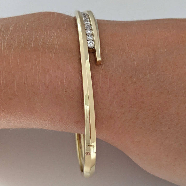 14K .54 CARAT TOTAL WEIGHT VS2 J DIAMOND ROUND (9) BYPASS CHANNEL SET ESTATE BANGLE 14.4 GRAMS