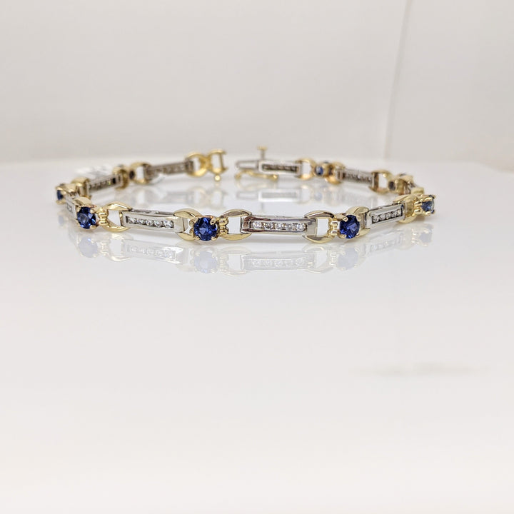 14K TWO-TONE LAB CREATED SAPPHIRE ROUND (8) 4MM WITH .67 DIAMOND CARAT TOTAL WEIGHT ESTATE BRACELET 12.7 GRAMS