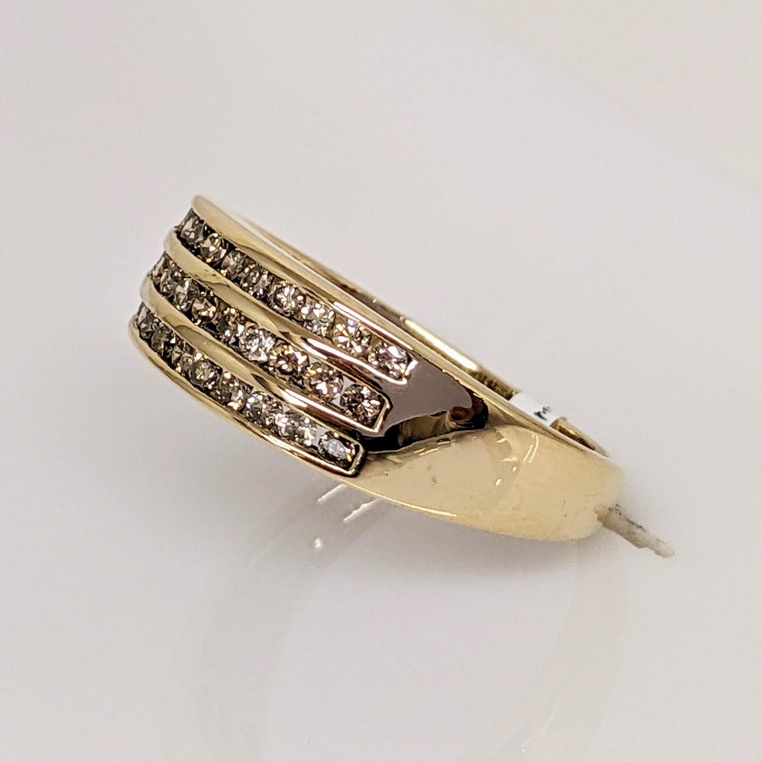10K .50 CARAT TOTAL WEIGHT I1 CHAMPAGNE (33) THREE- ROW ESTATE CHANNEL SET BAND 3.1 GRAMS