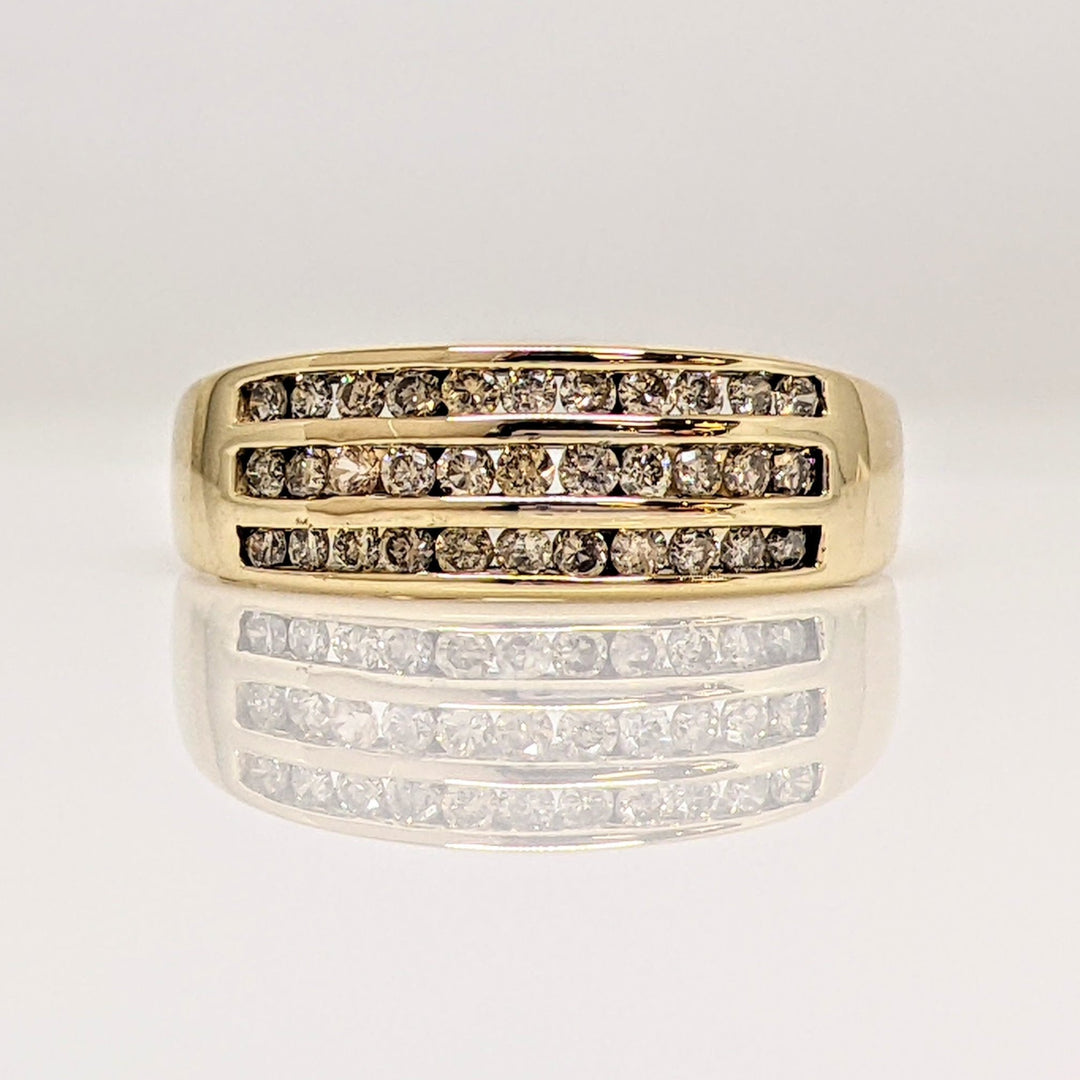 10K .50 CARAT TOTAL WEIGHT I1 CHAMPAGNE (33) THREE- ROW ESTATE CHANNEL SET BAND 3.1 GRAMS