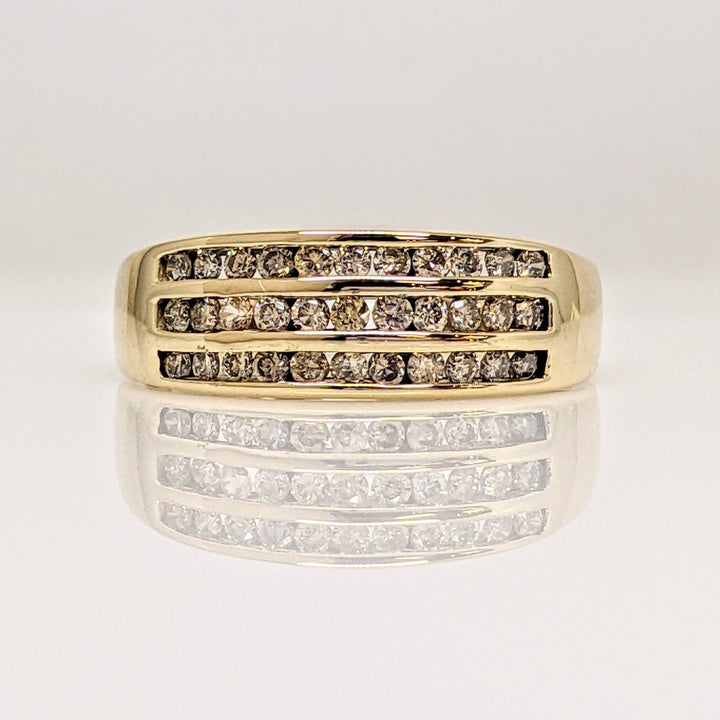 10K .50 CARAT TOTAL WEIGHT I1 CHAMPAGNE (33) THREE- ROW ESTATE CHANNEL SET BAND 3.1 GRAMS