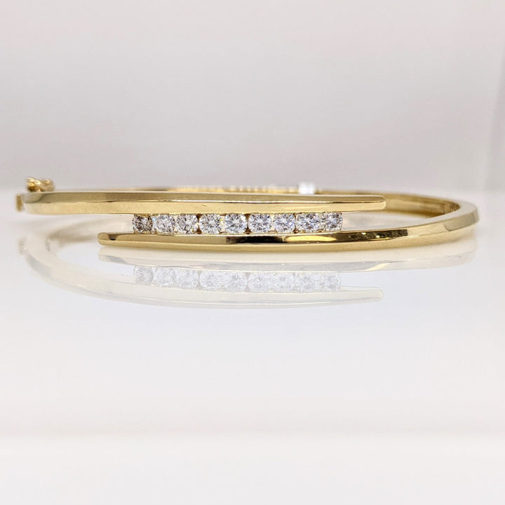 14K .54 CARAT TOTAL WEIGHT VS2 J DIAMOND ROUND (9) BYPASS CHANNEL SET ESTATE BANGLE 14.4 GRAMS