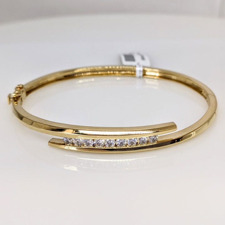 14K .54 CARAT TOTAL WEIGHT VS2 J DIAMOND ROUND (9) BYPASS CHANNEL SET ESTATE BANGLE 14.4 GRAMS