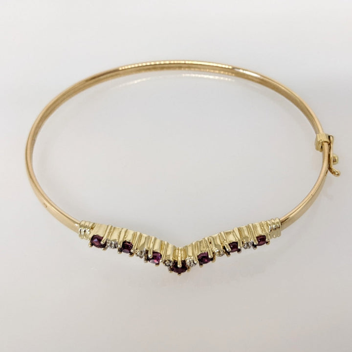 14K RUBY ROUND (7) 2.8-3MM WITH (6) MELEE ESTATE V-BANGLE 6.0 GRAMS
