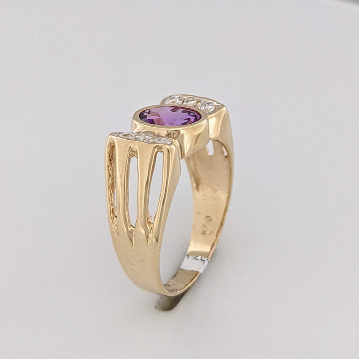 10K PURPLE LAB CREATED SAPPHIRE OVAL 6X8 BEZEL WITH (6) MELEE ESTATE RING 3.9 GRAMS