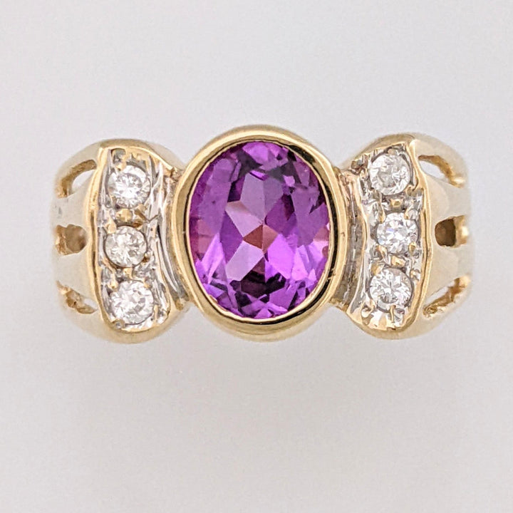 10K PURPLE LAB CREATED SAPPHIRE OVAL 6X8 BEZEL WITH (6) MELEE ESTATE RING 3.9 GRAMS