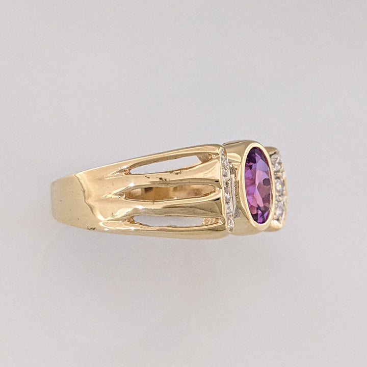 10K PURPLE LAB CREATED SAPPHIRE OVAL 6X8 BEZEL WITH (6) MELEE ESTATE RING 3.9 GRAMS