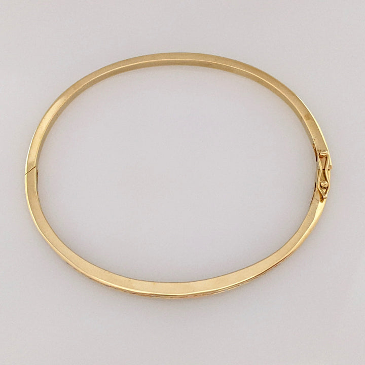 14K .70 CARAT TOTAL WEIGHT I1 H DIAMOND ROUND (35) CHANNEL SET ESTATE BANGLE 11.9 GRAMS