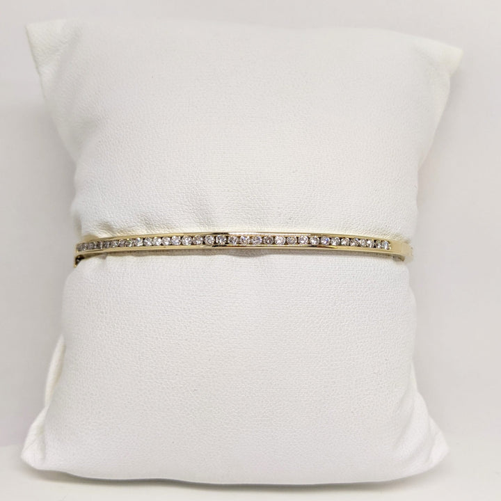 14K .70 CARAT TOTAL WEIGHT I1 H DIAMOND ROUND (35) CHANNEL SET ESTATE BANGLE 11.9 GRAMS