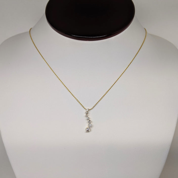 14K.44 CARAT TOTAL WEIGHT I1 I DIAMOND ROUND (7) ESTATE JOURNEY PENDANT & CHAIN 3.5 GRAMS