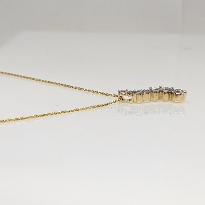14K.44 CARAT TOTAL WEIGHT I1 I DIAMOND ROUND (7) ESTATE JOURNEY PENDANT & CHAIN 3.5 GRAMS