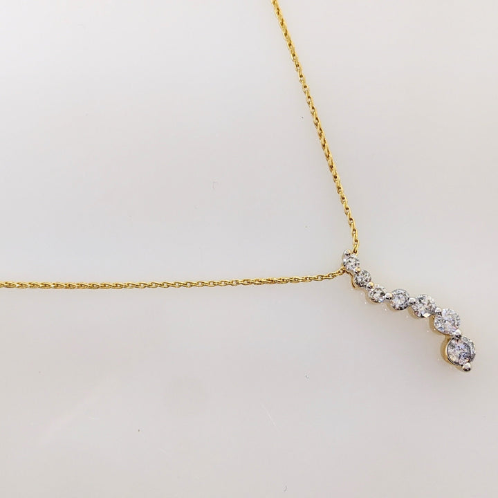 14K.44 CARAT TOTAL WEIGHT I1 I DIAMOND ROUND (7) ESTATE JOURNEY PENDANT & CHAIN 3.5 GRAMS