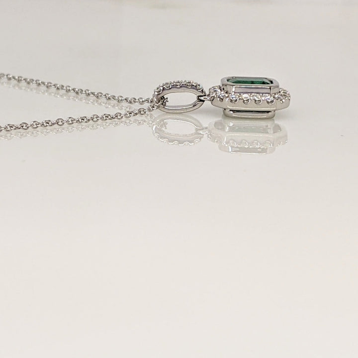 14K WHITE EMERALD .91 CARAT TOTAL EMERALD CUT BEZEL WITH .18 DIAMOND TOTAL WEIGHT ESTATE PENDANT & CHAIN 2.8 GRAMS