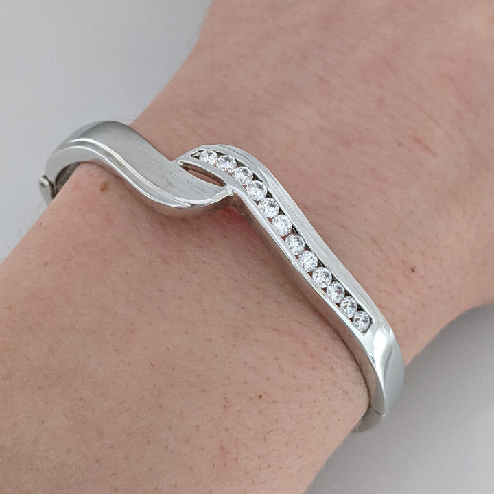 18K WHITE .72 CARAT TOTAL WIEGHT SI1 H DIAMOND ROUND (12) BYPASS CHANNEL SET ESTATE BANGLE 15.3 GRAMS