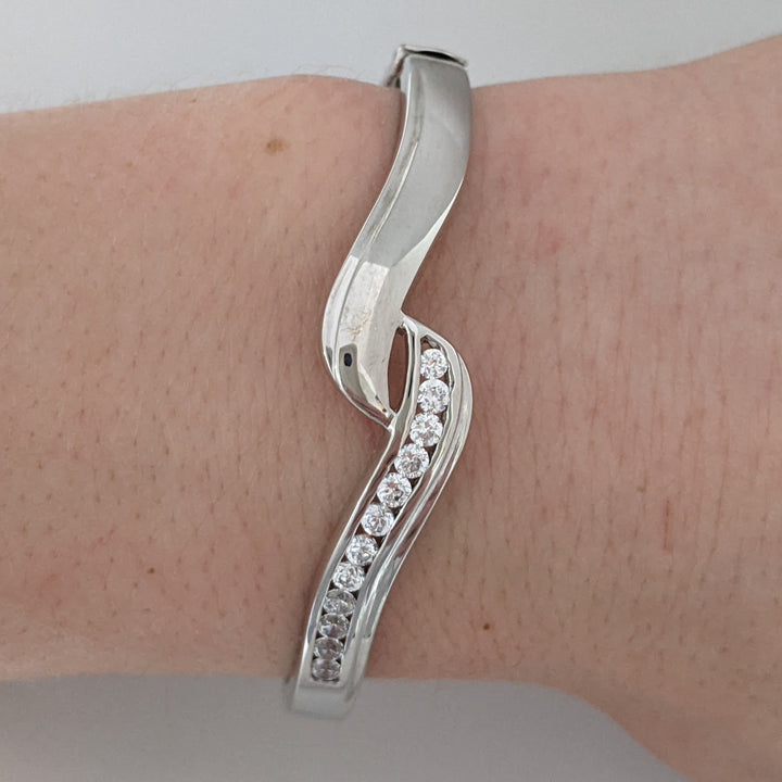 18K WHITE .72 CARAT TOTAL WIEGHT SI1 H DIAMOND ROUND (12) BYPASS CHANNEL SET ESTATE BANGLE 15.3 GRAMS