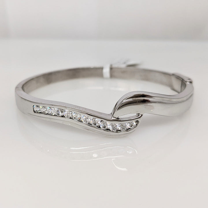 18K WHITE .72 CARAT TOTAL WIEGHT SI1 H DIAMOND ROUND (12) BYPASS CHANNEL SET ESTATE BANGLE 15.3 GRAMS