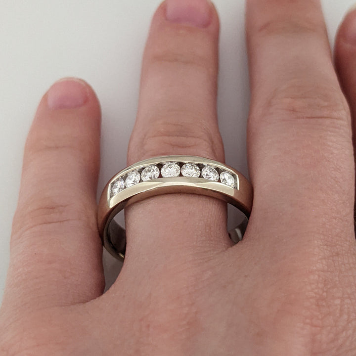 14K WHITE .62 CARAT TOTAL WEIGHT I1 I DIAMOND ROUND (7) ESTATE "LEO" CHANNEL-SET BAND 8.8 GRAMS