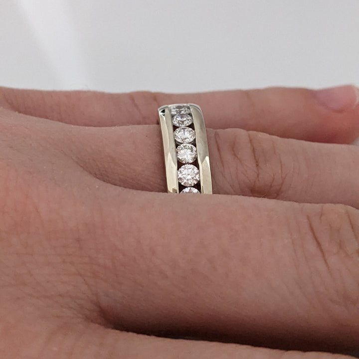 14K WHITE .62 CARAT TOTAL WEIGHT I1 I DIAMOND ROUND (7) ESTATE "LEO" CHANNEL-SET BAND 8.8 GRAMS