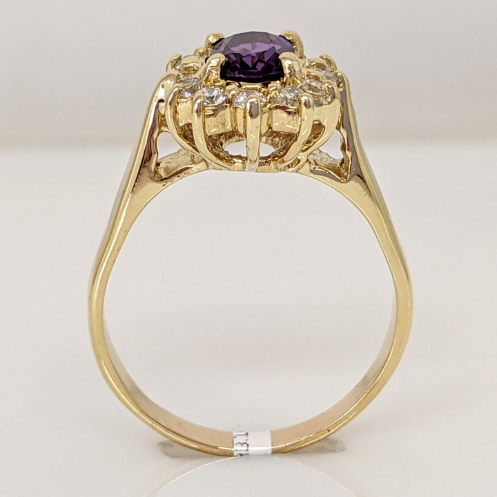14K AMETHYST OVAL 5X7 WITH .24 DIAMOND TOTAL WEIGHT (12) ESTATE RING 4.6 GRAMS