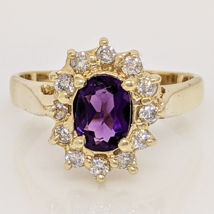 14K AMETHYST OVAL 5X7 WITH .24 DIAMOND TOTAL WEIGHT (12) ESTATE RING 4.6 GRAMS