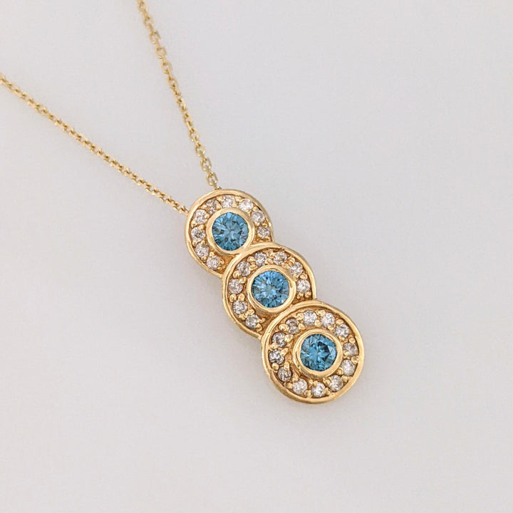 14K .65 CARAT TOTAL WEIGHT I1-I2 BLUE (3) WHITE (29) BEZEL ESTATE PENDANT & CHAIN 3.6 GRAMS