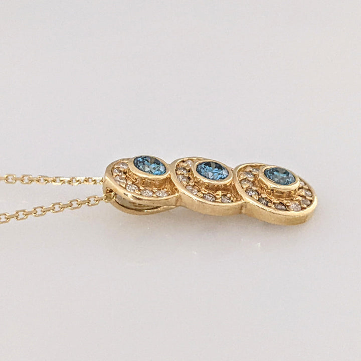 14K .65 CARAT TOTAL WEIGHT I1-I2 BLUE (3) WHITE (29) BEZEL ESTATE PENDANT & CHAIN 3.6 GRAMS