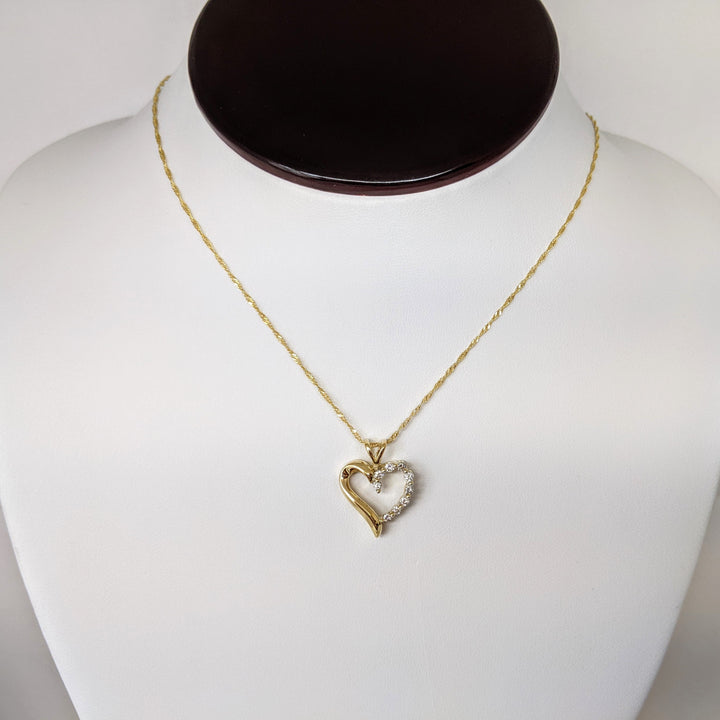 14K .27 CARAT TOTAL WEIGHT I1 I DIAMOND ROUND (9) ESTATE HEART PENDANT & CHAIN 3.9 GRAMS