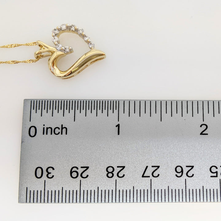 14K .27 CARAT TOTAL WEIGHT I1 I DIAMOND ROUND (9) ESTATE HEART PENDANT & CHAIN 3.9 GRAMS