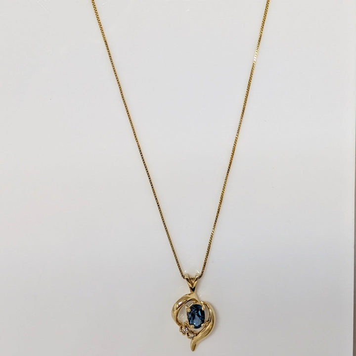 14K BLUE TOPAZ OVAL 4X6 WITH (2) MELEE FREE FORM ESTATE PENDANT & CHAIN 2.3 GRAMS