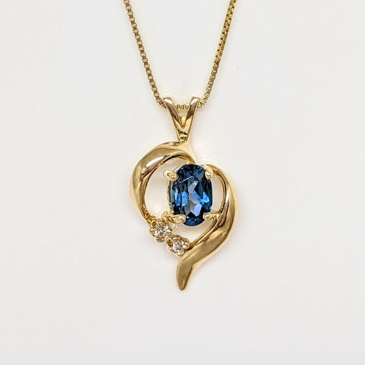 14K BLUE TOPAZ OVAL 4X6 WITH (2) MELEE FREE FORM ESTATE PENDANT & CHAIN 2.3 GRAMS