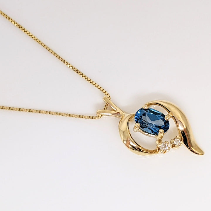 14K BLUE TOPAZ OVAL 4X6 WITH (2) MELEE FREE FORM ESTATE PENDANT & CHAIN 2.3 GRAMS