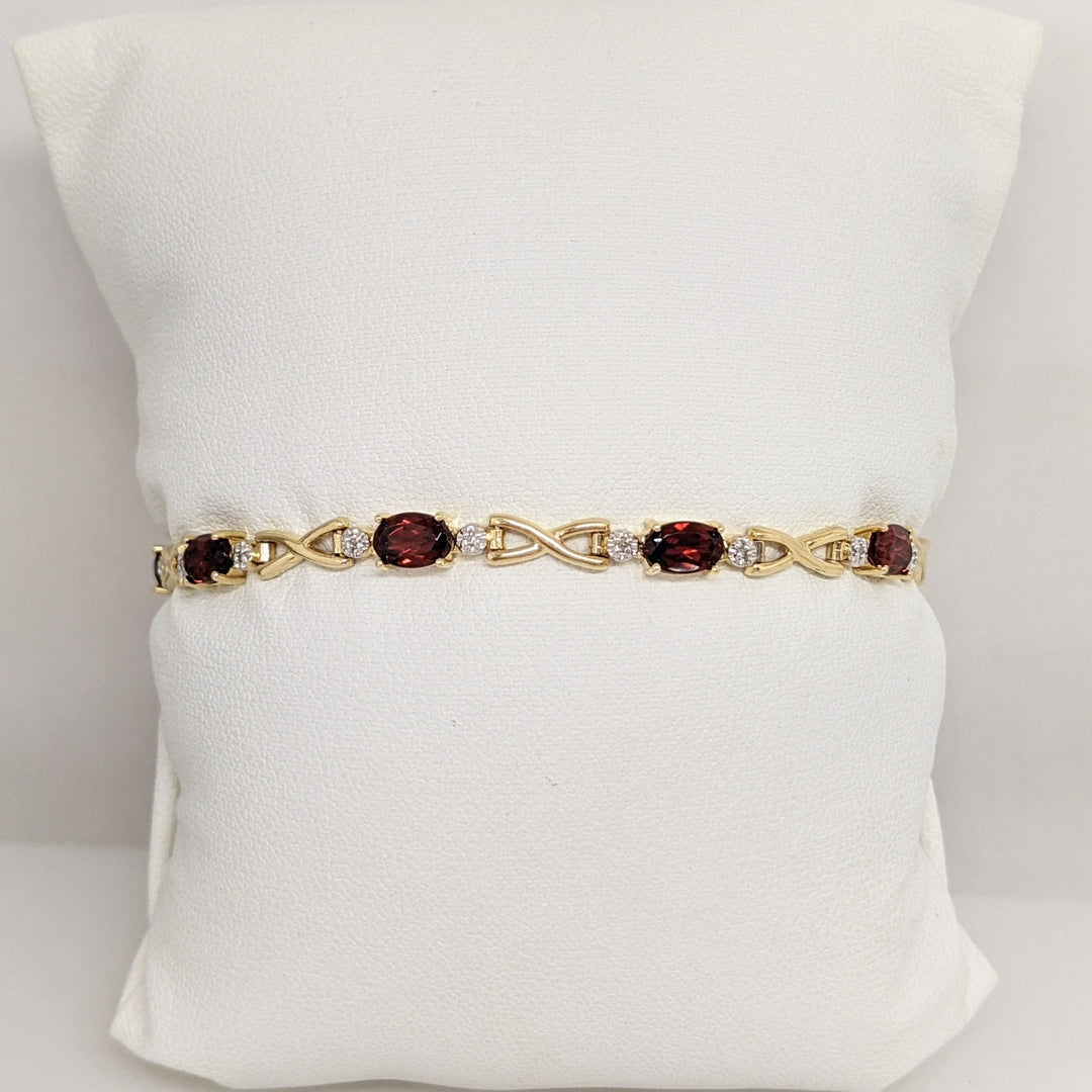 14K GARNET OVAL (9) 4X6 WITH MELEE ESTATE LINK BRACELET 6.2 GRAMS