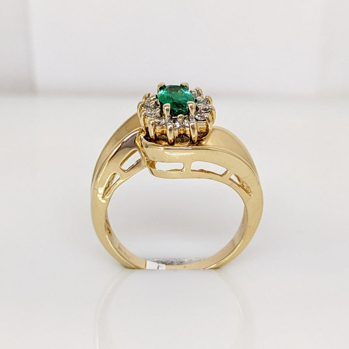 14K EMERALD OVAL  4X6 WITH .12 DIAMOND TOTAL WEIGHT (12) ROUND ESTATE RING 4.7 GRAMS