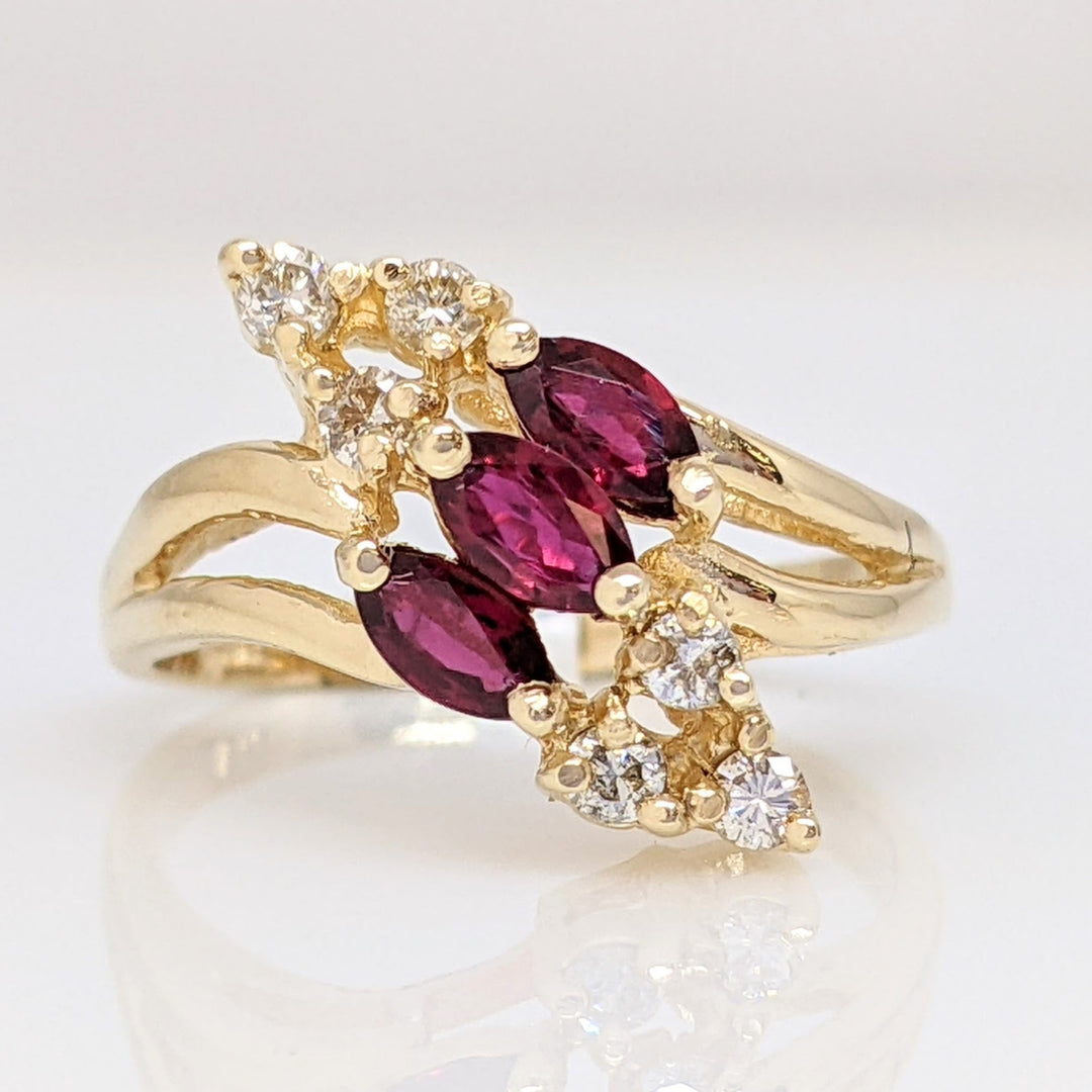 14K RUBY MARQUISE (3) 2.5X4 WITH .12 DIAMOND TOTAL WEIGHT I1 I (6) ROUND ESTATE RING 3.1 GRAMS