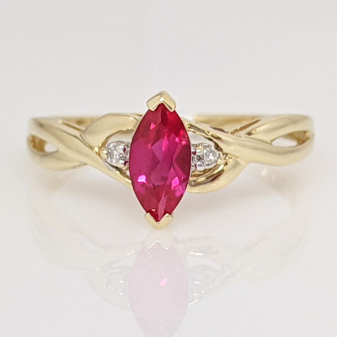 10K SYNTHETIC RUBY MARQUISE 4X8 WITH (2) MELEE ESTATE RING 1.4 GRAMS