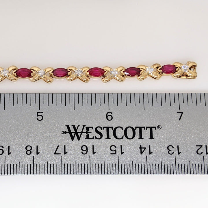 14K RUBY OVAL 3X4 (9) WITH .12 DIAMOND TOTAL WEIGHT ESTATE BRACELET 8.0 GRAMS