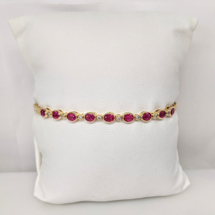 14K RUBY OVAL 3X4 (9) WITH .12 DIAMOND TOTAL WEIGHT ESTATE BRACELET 8.0 GRAMS